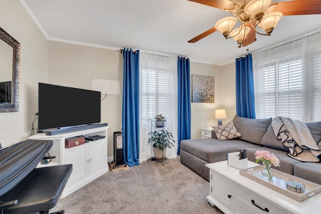 living room with ceiling fan, light colored carpet, and ornamental molding