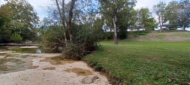 view of yard with a water view