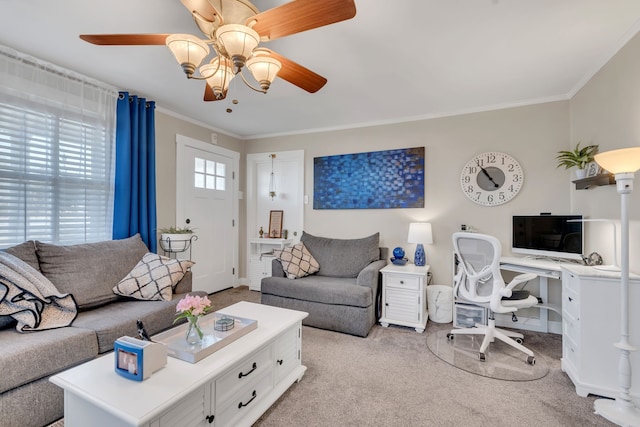 carpeted living room with ceiling fan and crown molding