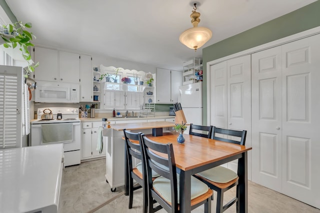 dining room featuring sink