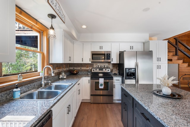 kitchen featuring white cabinetry, appliances with stainless steel finishes, and sink