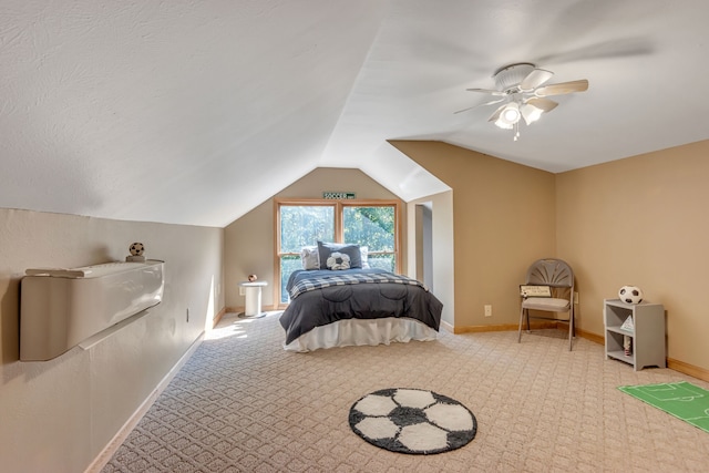 bedroom featuring vaulted ceiling, light carpet, and ceiling fan