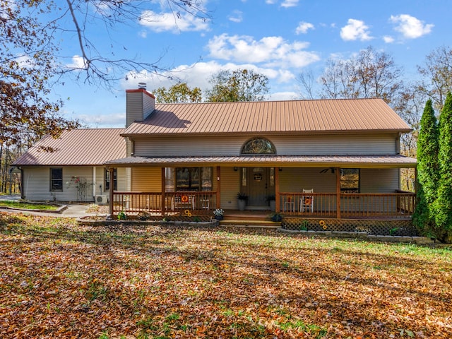 back of house with covered porch