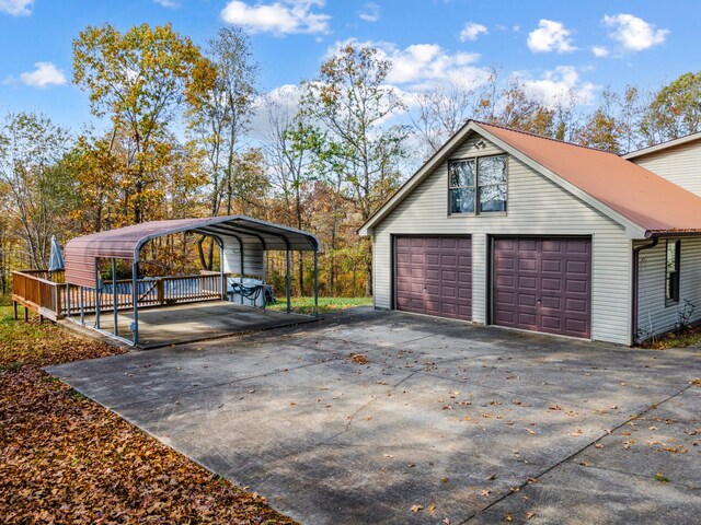 view of property exterior with a garage and a carport