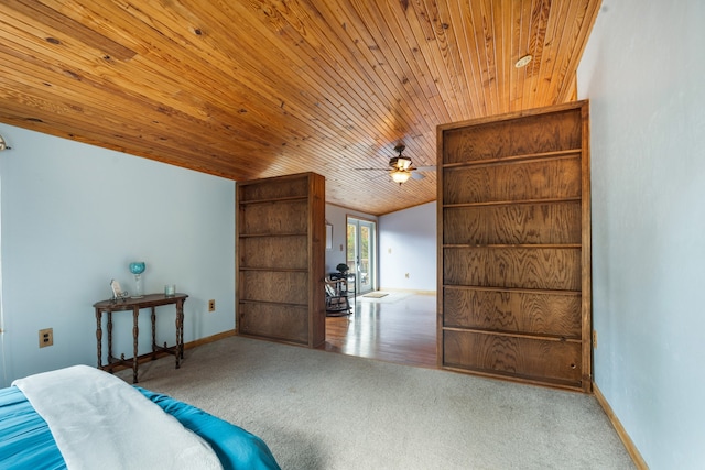 carpeted bedroom featuring wooden ceiling and lofted ceiling