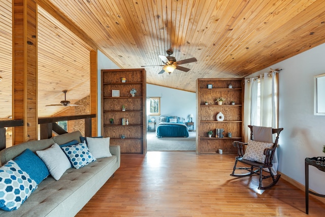 living room featuring lofted ceiling, wood ceiling, ceiling fan, and light hardwood / wood-style flooring