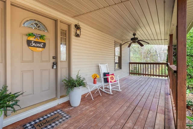 wooden terrace featuring ceiling fan and covered porch