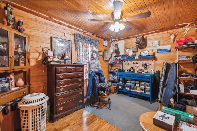 interior space featuring wooden ceiling, hardwood / wood-style flooring, and wooden walls