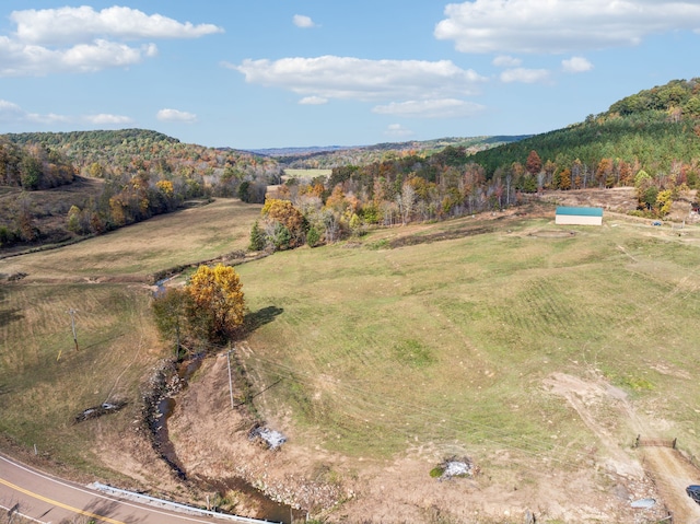 birds eye view of property featuring a rural view