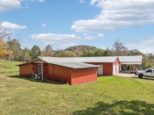 view of outdoor structure with a lawn