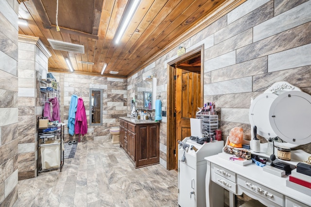 bathroom featuring toilet, vanity, wood-type flooring, and wooden ceiling