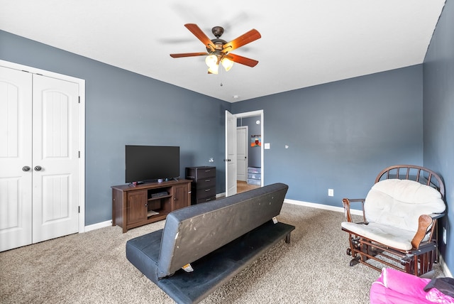 living room with ceiling fan and carpet floors