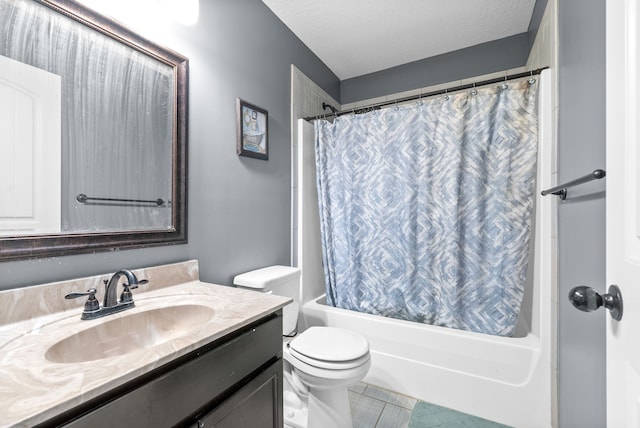 full bathroom with vanity, shower / tub combo, a textured ceiling, and toilet