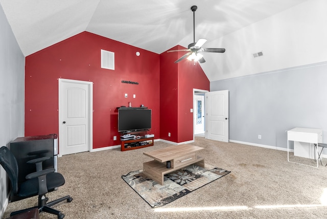 carpeted living room with ceiling fan and high vaulted ceiling