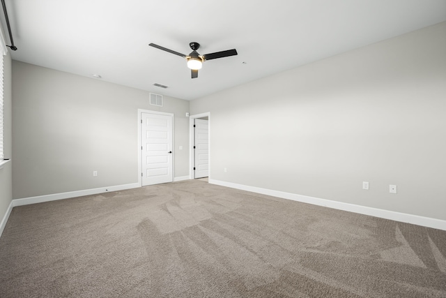 empty room featuring ceiling fan and carpet floors