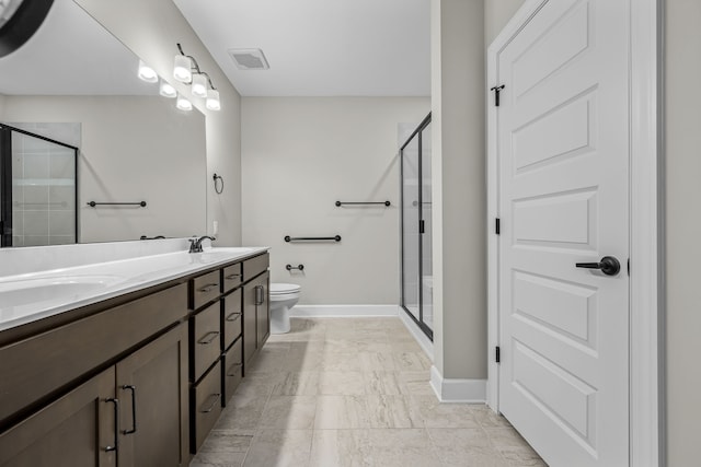 bathroom with toilet, vanity, and an enclosed shower