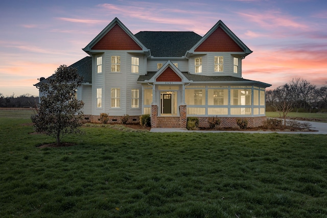 craftsman house with a lawn