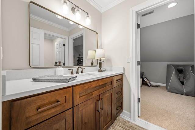 bathroom with vanity and crown molding