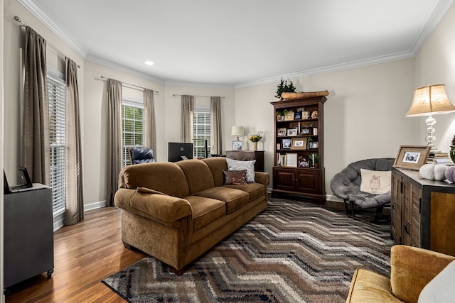 living room with dark hardwood / wood-style floors and crown molding