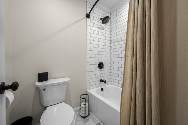 bathroom featuring shower / bath combination with curtain and toilet