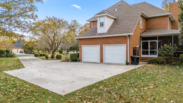 view of property exterior with a garage and a yard