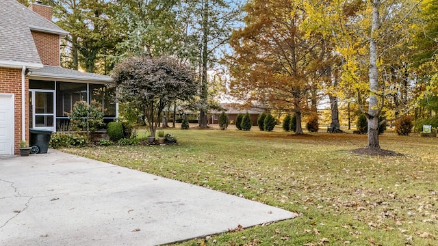 view of yard with a sunroom