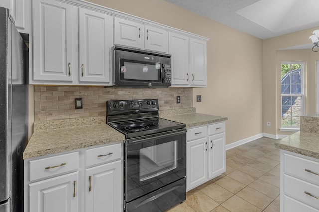 kitchen featuring white cabinets, black appliances, light tile patterned floors, and tasteful backsplash