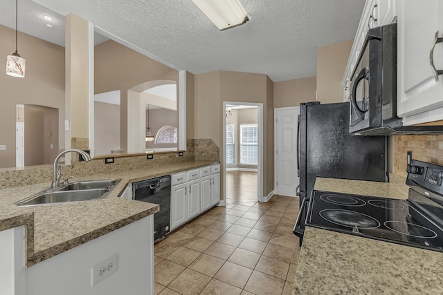 kitchen with white cabinets, a textured ceiling, sink, and black appliances