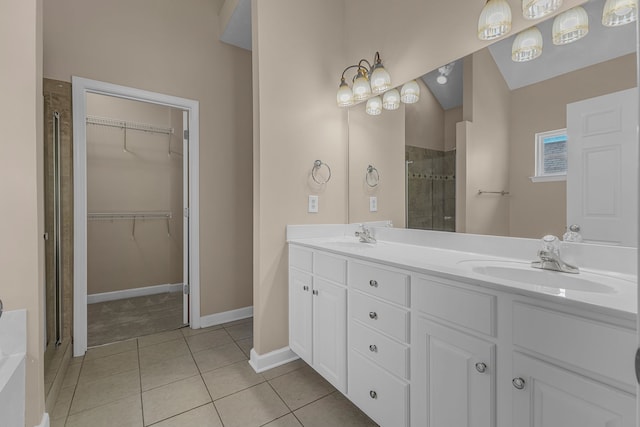 bathroom featuring vanity, tile patterned floors, and a shower with shower door