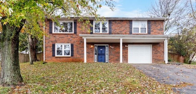 view of front facade featuring a garage and a front yard