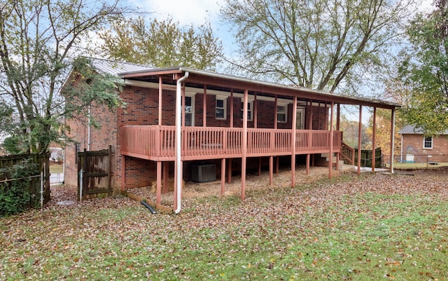 rear view of property featuring central air condition unit and a deck