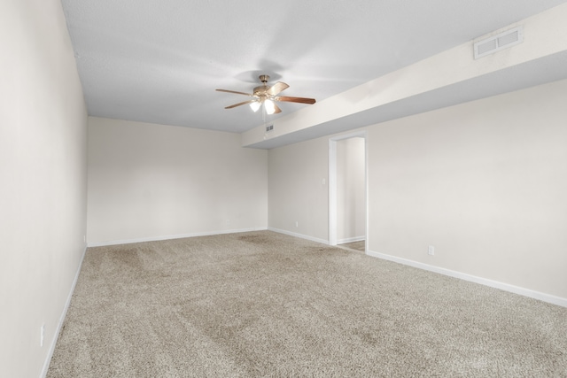 empty room with carpet and ceiling fan