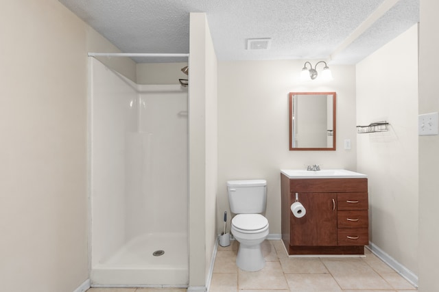 bathroom featuring walk in shower, tile patterned flooring, vanity, and a textured ceiling