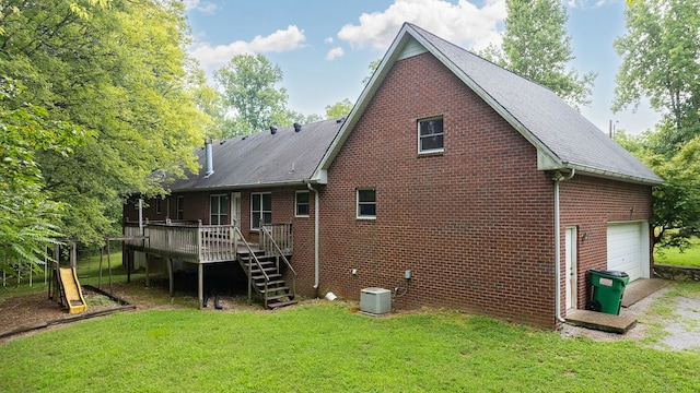 back of property featuring central AC unit, a yard, and a wooden deck