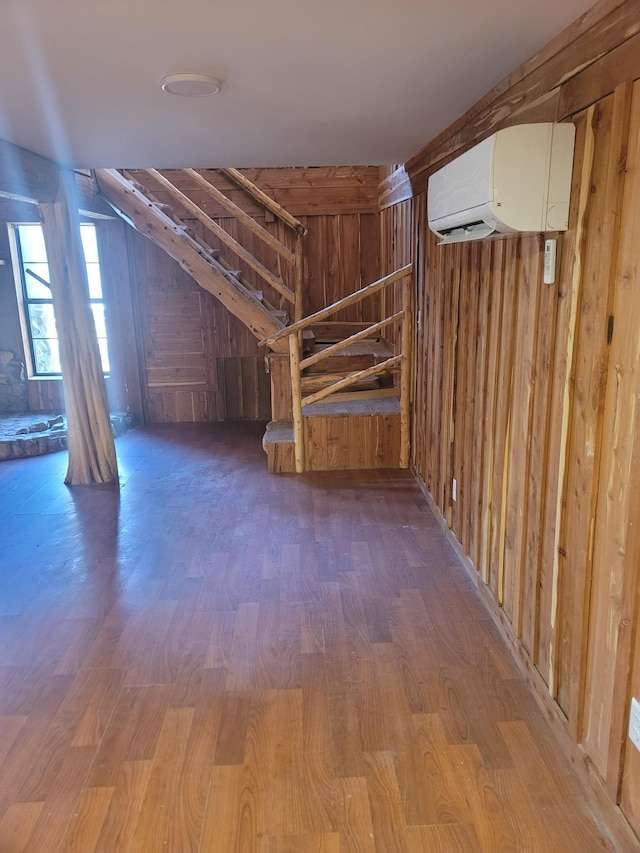 180 Mount View Estates Ln, Holladay, TN 38341 - basement with a wall mounted air conditioner, wood finished floors, and wooden walls