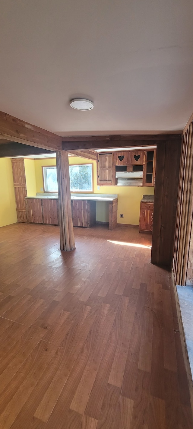 unfurnished living room with hardwood / wood-style floors