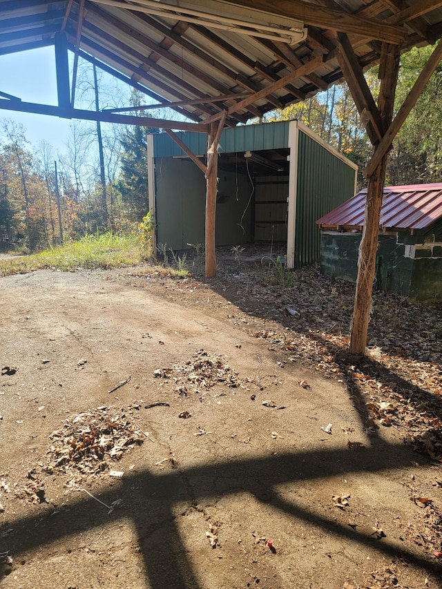 180 Mount View Estates Ln, Holladay, TN 38341 - view of yard featuring a carport and an outbuilding