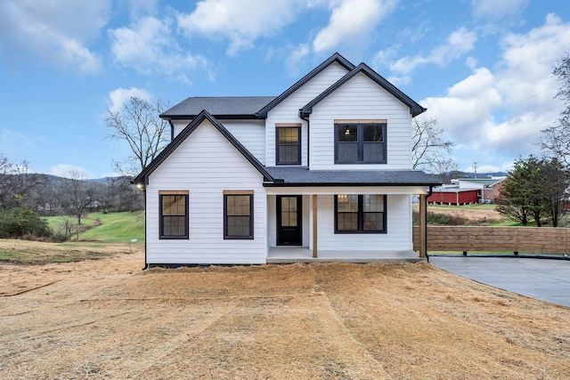 modern inspired farmhouse with covered porch