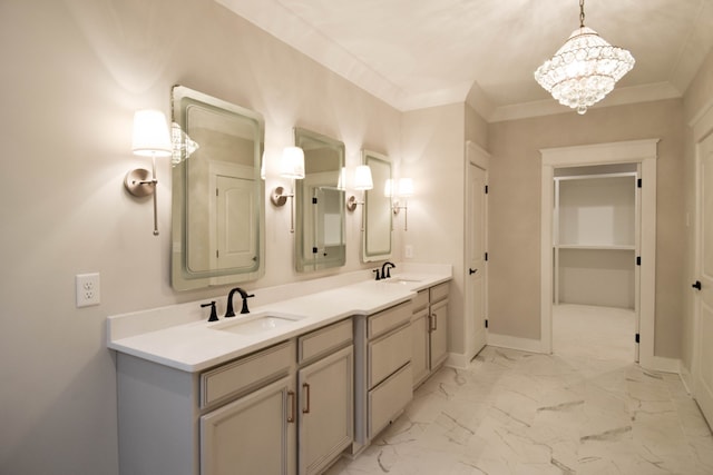 bathroom with ornamental molding, marble finish floor, and a sink