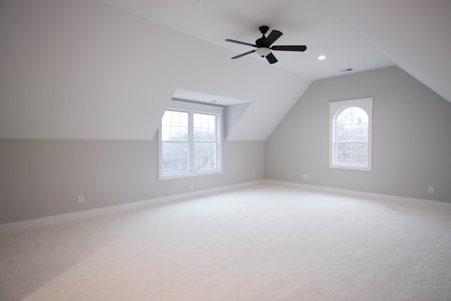 bonus room featuring carpet floors, visible vents, vaulted ceiling, ceiling fan, and baseboards