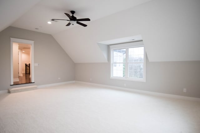 bonus room featuring vaulted ceiling, ceiling fan, carpet flooring, and baseboards