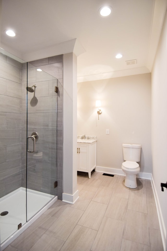 full bathroom with ornamental molding, a stall shower, visible vents, and baseboards