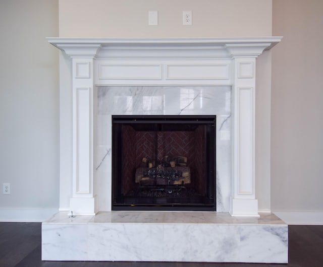 room details with a fireplace and baseboards