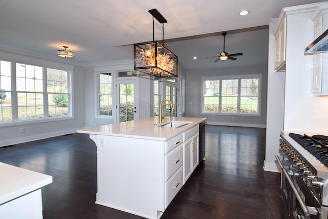 kitchen featuring a sink, double oven range, open floor plan, and dishwasher