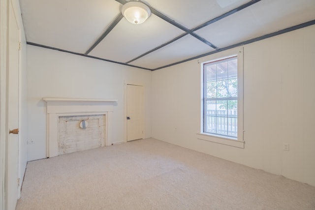 unfurnished living room featuring light carpet