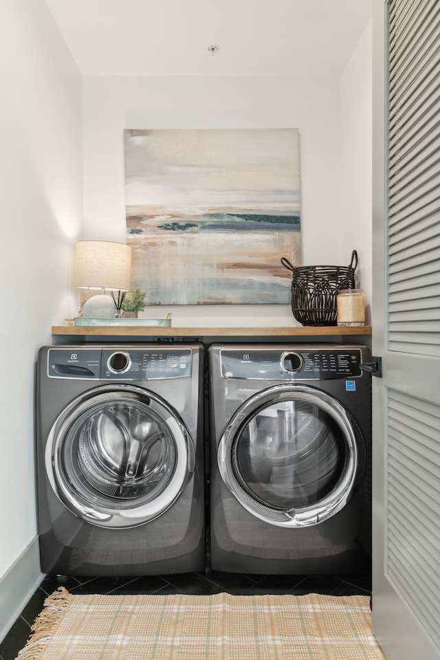 laundry area featuring washing machine and dryer