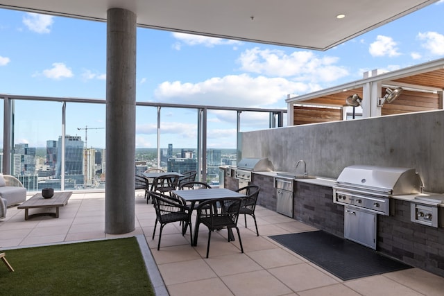 view of patio featuring area for grilling, sink, and an outdoor kitchen