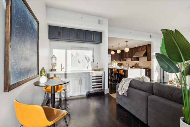 1616 W End Ave Unit 2911, Nashville, TN 37203 - living area with beverage cooler, dark wood-style flooring, and bar