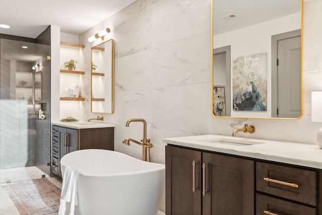1616 W End Ave Unit 2911, Nashville, TN 37203 - full bathroom with two vanities, a shower stall, tile walls, and a soaking tub