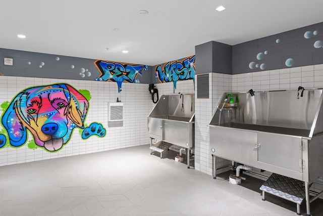 1616 W End Ave Unit 2911, Nashville, TN 37203 - misc room with pet washing area and tile walls